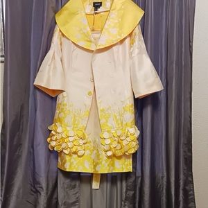 Selling a yellow suit with matching shoes .
